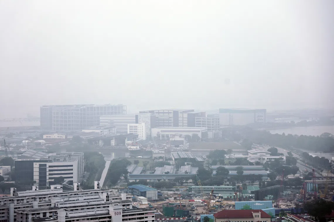 Haze reducing visibility over buildings in Singapore. Image source: The Straits Times.