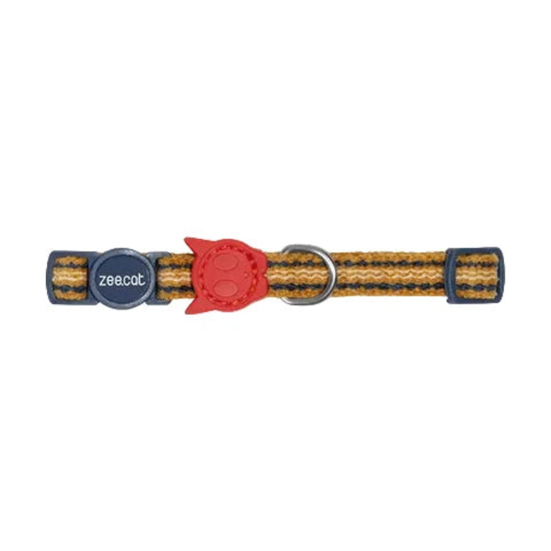 A woven cat collar with a yellow, orange, and dark blue pattern, featuring a red turtle-shaped plastic chew attachment and a dark blue metal buckle with the brand name 'zeaco' visible.